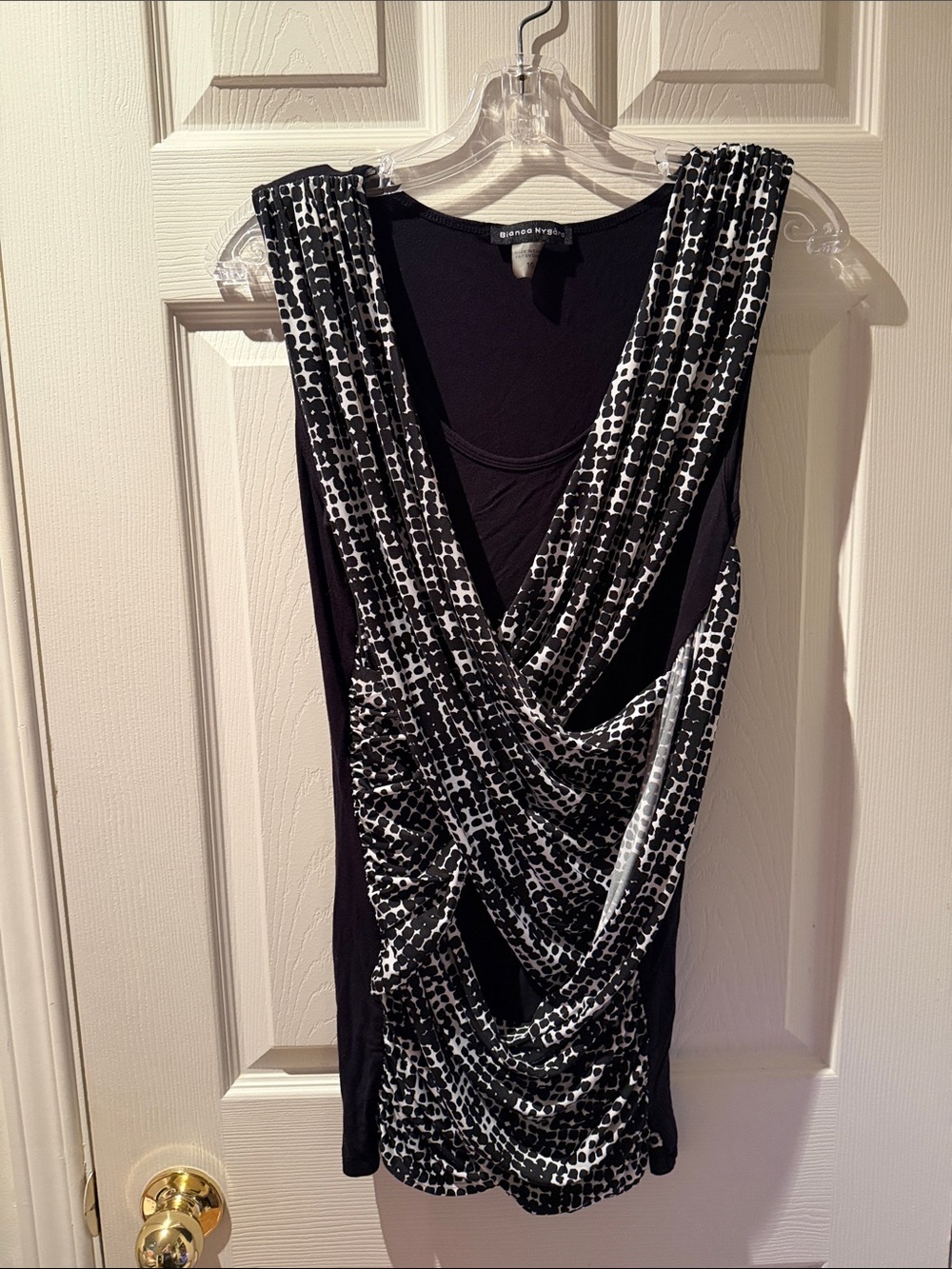 50 - Sleeveless Black Tunic with Black-and-White Draped Overlay